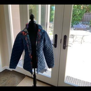 North Face blue puffer jacket with flower pattern